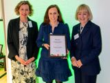 A photo of Dr Kathryn Dalrymple receiving her award at the BNF Annual Conference